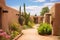 pueblo adobe walls enclosing a desert garden
