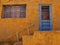 Pueblo-style adobe home in New Mexico with blue door