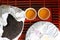 Puer tea. Packed pancake of traditional chinese puer tea with white teaput. Asian pressed pu-erh tea and crockery tea set, clay