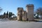 Puerta de Palmas entrance towers on a middle of a road in Badajoz, Spain
