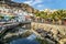 Puerto de Mogan, Spain â€“ January 17, 2016: View of canal, resting people in the restaurant in Puerto de de Mogan.