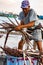 Puerto Lopez / August 19, 2016 - Fisherman sorts his catch of pi