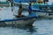 Puerto Lopez Ecuador, 9-7-2019: A pelican flying next to a fisherman boat