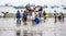 Puerto Lopez, Ecuador / Nov 26, 2012: Workers swarm small fishing boat