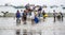 Puerto Lopez, Ecuador - Nov 26, 2012: Workers swarm small fishing boat