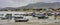 Puerto Lopez, Ecuador - September 12, 2018 - Fishermen finish their day fixing nets, cleaning boats, and talking with