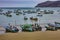 Puerto Lopez, Ecuador - September 12, 2018 - Fishermen finish their day fixing nets, cleaning boats, and talking with