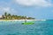 Puerto Morelos seaside view with sea and boats. Caribbean sky with clouds. White sand shore. Background or wallpaper. Yucatan. Qui