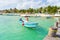 Puerto Morelos seaside view with sea and boats. Caribbean sky with clouds. White sand shore. Background or wallpaper. Yucatan. Qui