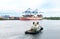 Puerto Quetzal, Guatemala. Working Tug Boat in Harbour with Container ship in Background