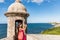 Puerto Rico San Juan woman taking phone pictures of Old San Juan Fort Castillo San Felipe Del Morro. Asian tourist people