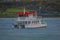 PUERTO VARAS, CHILE, SEPTEMBER, 23, 2018: Outdoor view of boat in Llanquihue in Puerto Varas and coastline in the