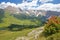 Puez Odle mountain range viewed from a hiking pass leading to Mount Pic above Raiser Pass with colorful flowers in the foregroun