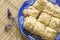 Puff cakes on blue dish, napoleon cakes, top view