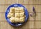 Puff cakes on blue dish, napoleon cakes, top view