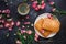 Puff pastries and coffee, Sweets and flowers, Dark background, Top view, March 8, Women`s Day