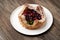 Puff pastry cake with berries on wooden background