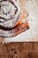 Puff pastry cakes curl with powdered sugar on top. A close-up of a bakery product. Confectionery work and customer service. A
