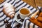 Puff pastry, coffee cup and buttered French croissant on wooden crate. Food and breakfast concept. Detail of coffee desserts and