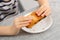 Puff pastry enjoyment: Delightful moments as a child prepares to indulge in a golden-brown treat