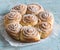 Puff pastry swirls rolls on a wooden blue background. Delicious sweet pastries