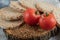 Puffed crispbread, tomatoes and raw buckwheat on marble surface