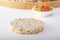 Puffed exploded wheat grains on candied fruit background
