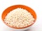 Puffed rice in a bowl over white background