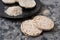 Puffed rice bread slices on black plate on textured background