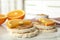 Puffed rice cakes with peanut butter and orange on table, closeup