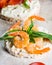 Puffed rice cakes with shrimps and avocado on board. Seafood snack. Crispbread, bread crusts. diet food concept. Basil