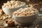 Puffed sweet rice in caramel in white porcelain bowls with cane