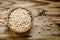 Puffed sweet rice in a round bowl on the old wooden background,