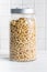 Puffed wheat covered with honey in jar. Cereal breakfast