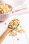 Puffed wheat covered with honey in wooden spoon