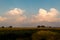 Puffy cumulus clouds on a bright midsummer morning, over Illinois farmland