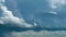 Puffy fluffy white clouds blue sky raining time lapse motion background. Clouds Forming In Dramatic Sky. Nature Environment cloud