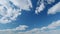 Puffy fluffy white clouds. Forming cloud moving with blue sunny, summer skies. Timelapse.