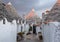 Puglia, Italy. Traditional conical roofed trulli houses on a street in Alberobello with pumpkins for halloween.