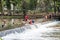 PULHAPANZAK, HONDURAS - APRIL 18, 2016: People are bathing in a river above Pulhapanzak waterfal