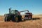 Pull Combine Dumping into Grain Truck