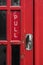 PULL sign on a bright red door.