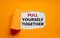Pull yourself together symbol. The text `Pull yourself together` appearing behind torn orange paper. Business, motivational and