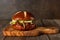 Pulled pork burger on a serving board against wood