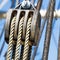 Pulley with hemp ropes, as construction of a triple pulley for the rigging of a sailing ship