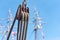 Pulley with ropes against a blue sky and masts with colored flags