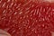 The pulp of a red grapefruit close-up. Closeup