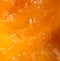 Pulp ripe persimmons as a background. macro