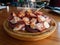 Pulpo a la gallega in Spanish meaning Galician-style octopus a traditional Galician dish served on the wooden plate