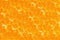Pulpy texture of an orange juicy fruit flesh for a background